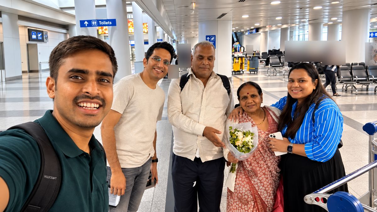 MatchMyFlight founder Nikhil with a family at Chicago O'Hare after their flight from Delhi.